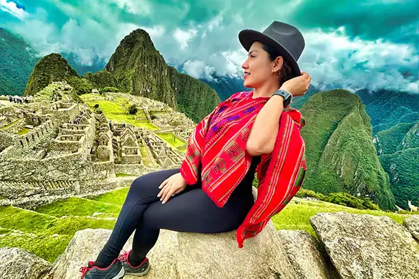 Beautiful girl sitting in Machipicchu